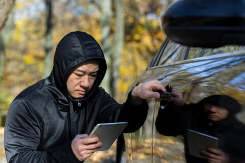 male bandit thief car thief asian uses a tablet to 2023 11 27 05 36 06 utc